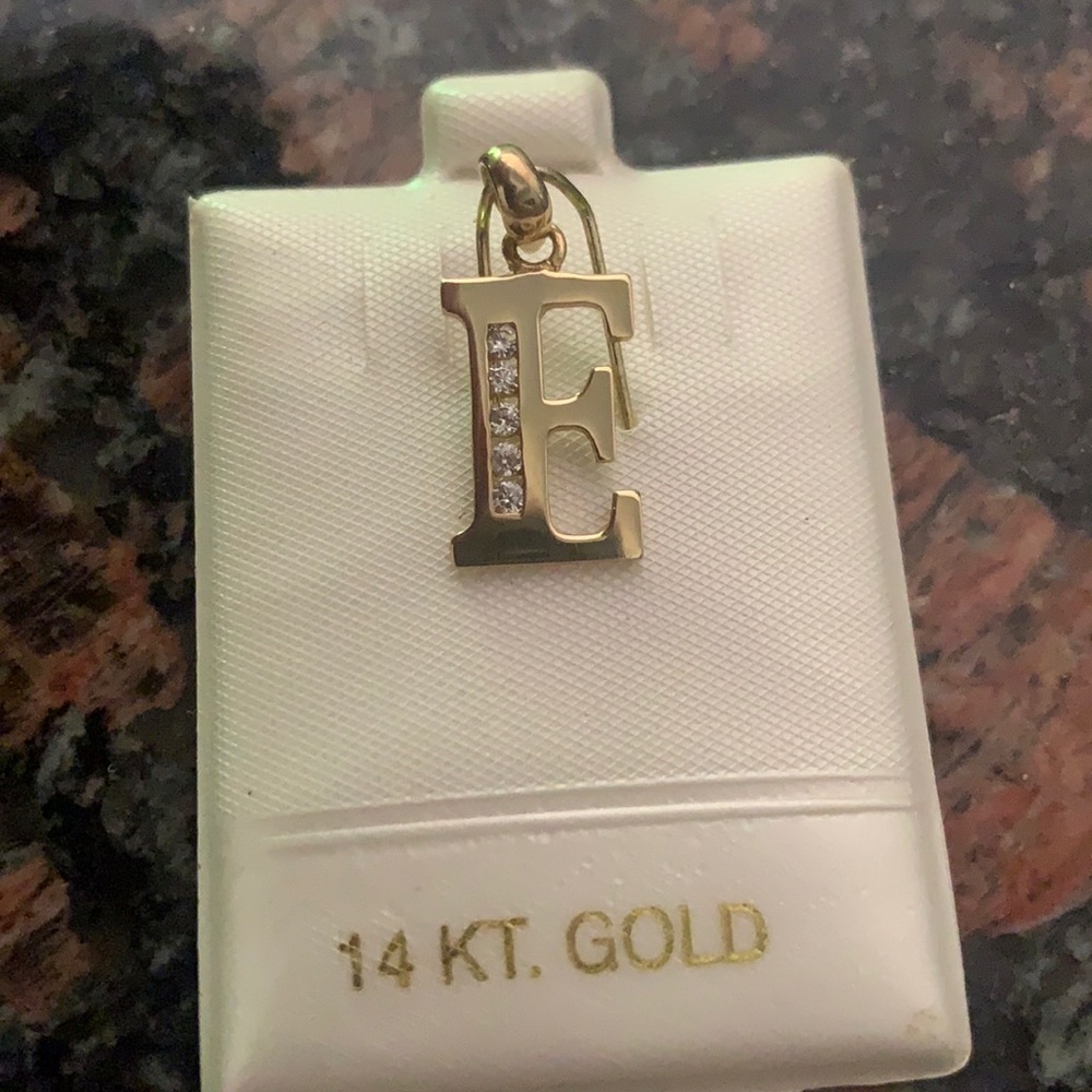 Pure 14 karat yellow gold “E” initial pendant